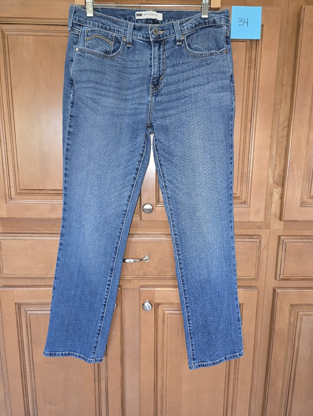 Levi's women's medium wash blue straight-leg stretch denim jeans with a classic